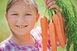 A kid with carrots